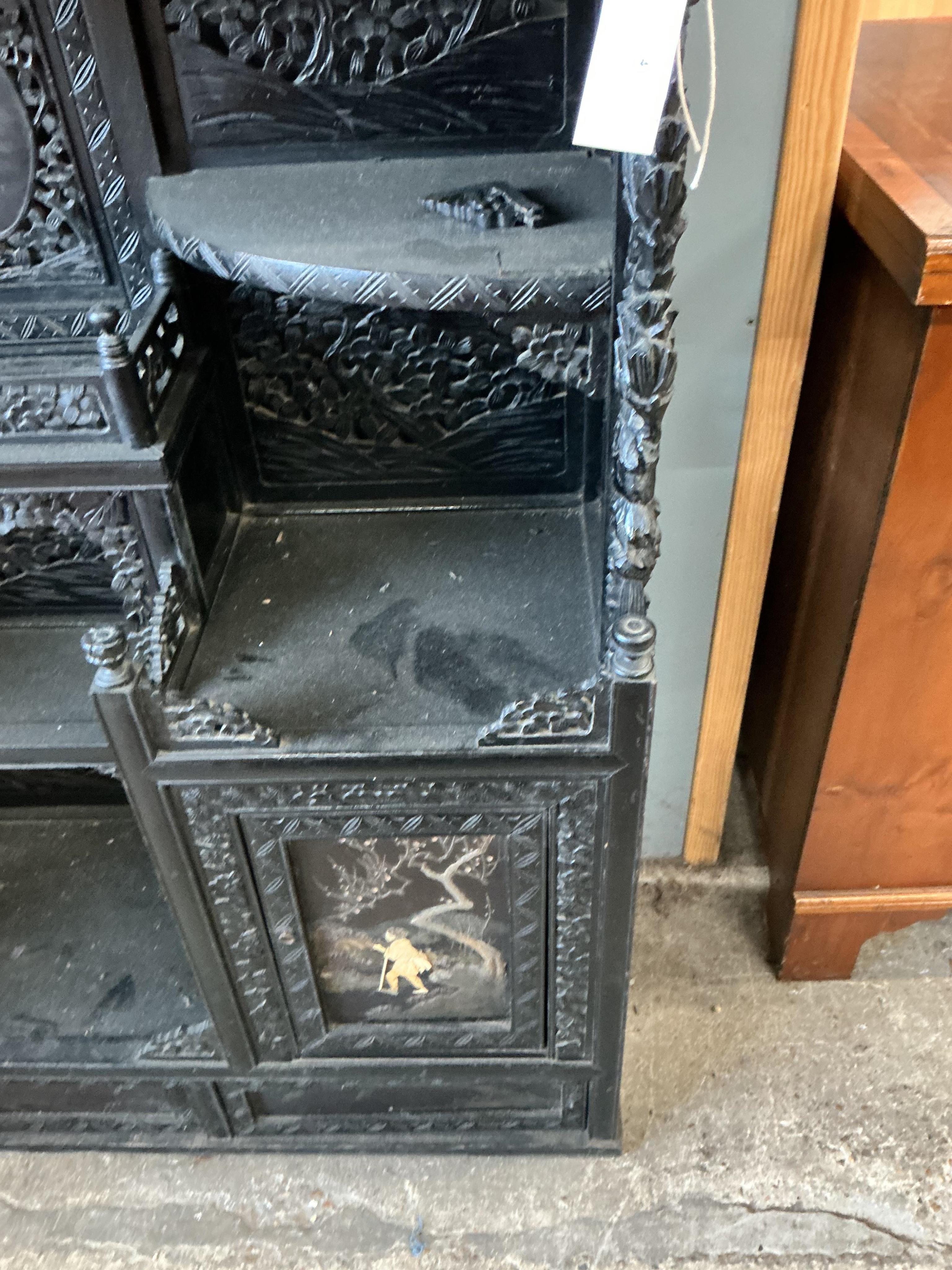 A Japanese Meiji period ebonised cabinet, width 110cm, depth 32cm, height 150cm CITES Submission reference Q4A31H9Q